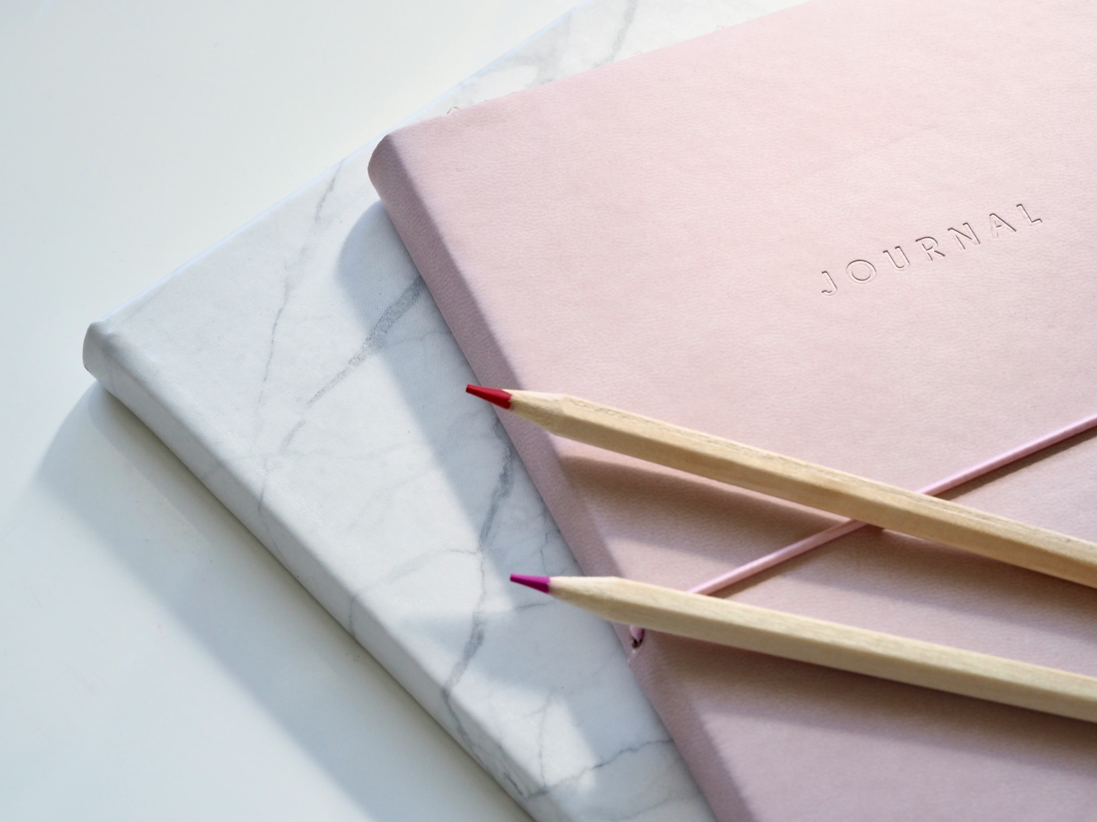 Pink notebook with pencils
